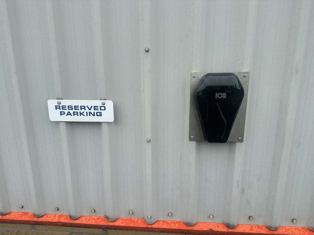 Workplace EV charge point on a cladded wall
